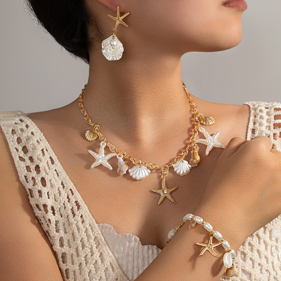 Golden Farbe Oberstoff Eisen Detail Mit Seestern und Samen Perlen Kettenarmbänder Baumeln Kettenhalsketten Sets